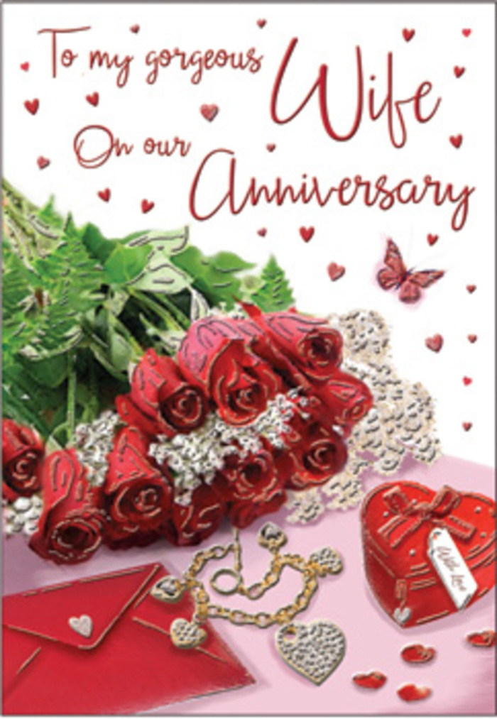 This image offers a richly layered anniversary vignette where classic romance is expressed through carefully chosen flowers and keepsakes, set against a backdrop that could easily belong to a sun-dappled home near Hackney Downs in Lower Clapton. At the heart of the composition stands a bouquet of traditional red roses, each bloom rounded and luxuriant, with petals arranged in tight, swirling layers that gradually open outward. Their bold crimson colour is both reassuring and passionate, a timeless choice for celebrating years of partnership. Lush green foliage peeks between the flowers, its fresh sheen making the roses appear even more vibrant, much like a freshly tied bouquet lifted straight from a local florist's workbench. Encircling the bouquet are meaningful accents: a jewellery set whose metallic tones glimmer softly, a vivid red box that evokes the anticipation of a surprise gift, and delicate heart motifs scattered throughout the scene. A folded envelope lies close by, implying a heartfelt message tucked inside-a note that might recall early walks along the River Lea or first dates in Lower Clapton cafés. Textures mingle harmoniously: the imagined smoothness of the card stock, the gentle nap of velvet, the cool slide of metal, and the soft, almost satin-like quality of rose petals. The light is warm yet restrained, casting gentle shadows that add depth without diminishing the coziness of the arrangement. Overall, the composition radiates a sense of intimate celebration, as if capturing the moment just before an anniversary dinner begins, when flowers, gifts, and written words wait patiently to be shared between two people who have built a life together.