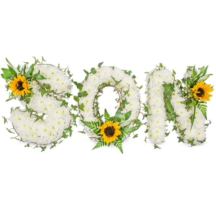 A carefully constructed sympathy display clearly spells out SON in capital letters, the whole piece set against a plain white background so the floral details register with clarity. Each letter is densely covered in pristine white chrysanthemums, their compact blooms creating a smooth, pillowed surface that looks almost tactile; you can almost imagine the soft touch of each petal. Interlaced through the white blossoms are winding strands of dark green ivy and sprigs of lighter green fern fronds, the contrast of deep and pale greens sculpting the letter edges and introducing a sense of growth and continuation. Three large sunflowers with golden-yellow petals and textured dark brown centres punctuate the design: one anchored on the upper-left curve of the S, one cradled in the lower arc of the O amid trailing greenery, and one affixed to the upper-right angle of the N. The sunflowers throw a warm glow across the arrangement, suggesting memory and light amid sorrow. As a florist familiar with the rhythms of Lower Clapton and nearby Lea Bridge Road services, I compose these tributes to be both visually readable from a distance at a chapel and intimate up close at a family memorial. Neutral, even lighting has been used to avoid harsh shadows, allowing the white chrysanthemums to convey peace while the ivy and sunflowers speak of endurance and bright recollection - an honouring, personalised floral testament for a son.